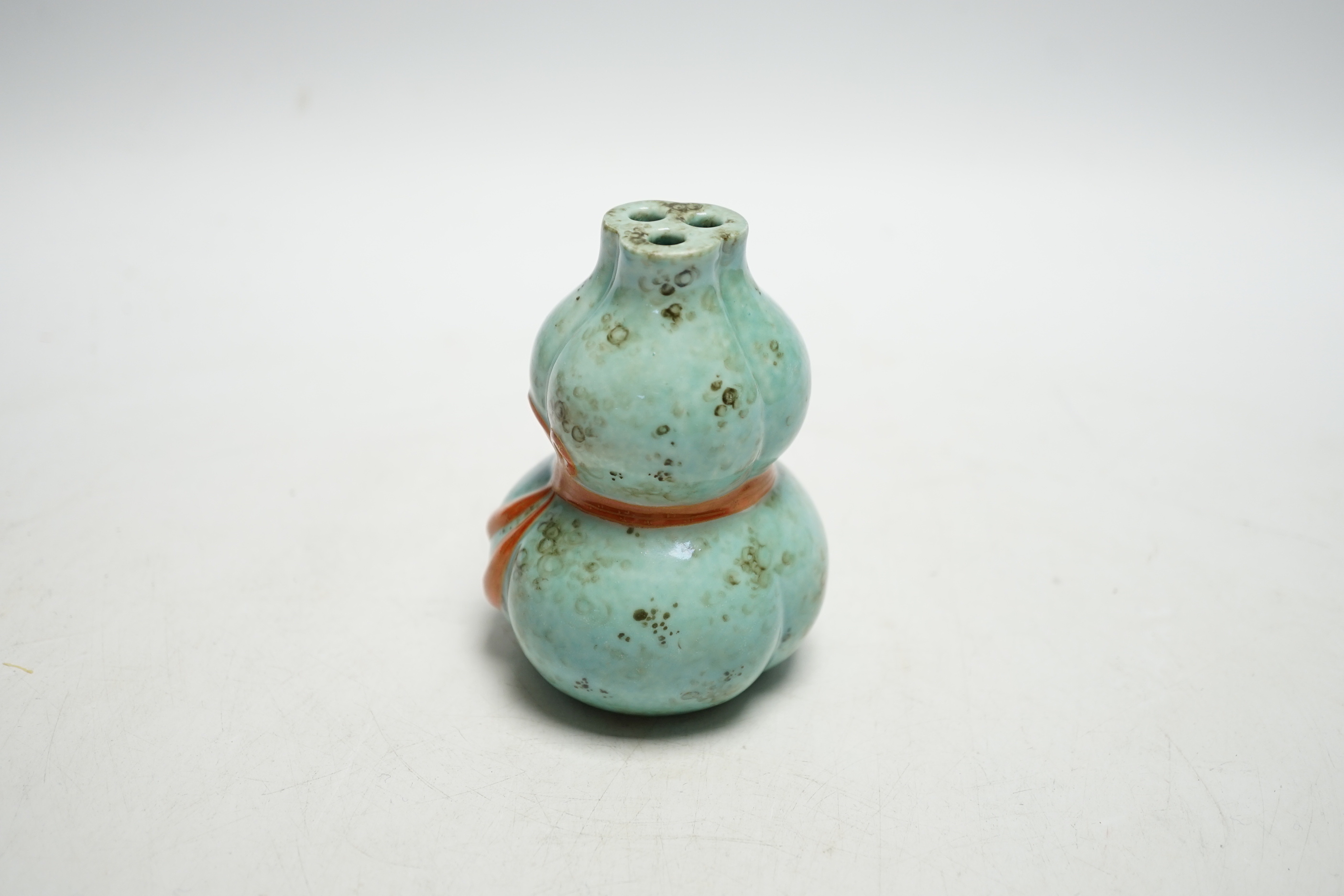 A Chinese enamelled porcelain gourd posy vase, 10cms high